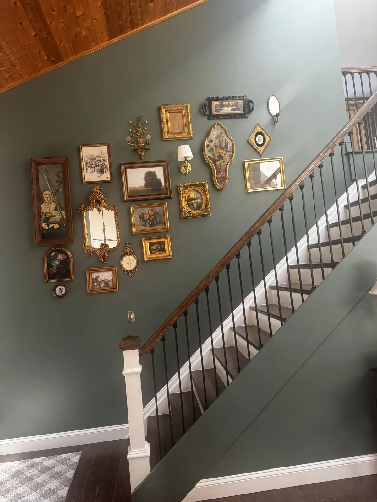 Staircase gallery wall with framed artwork