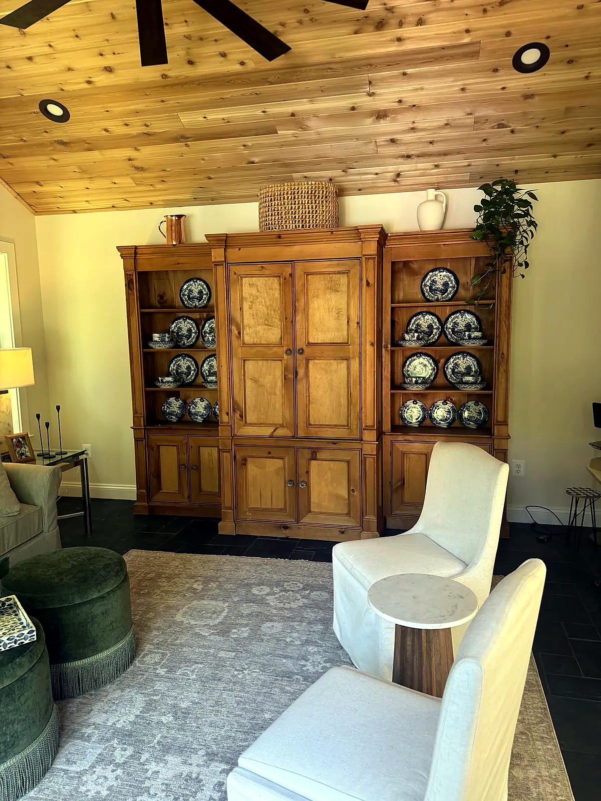 Pine-paneled sitting room with a china display cabinet